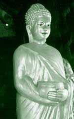 Buddha holds his alms bowl