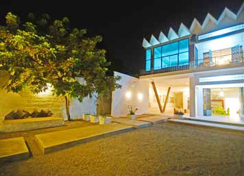 The modernist facade of Hotel 1961, which has a room devoted to Khmer architect Vann Molyvann.