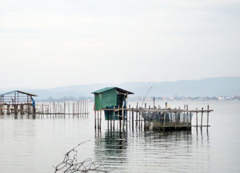 This scenic view across Koh Por river towards Koh Kong city shows two of the province’s fish farms